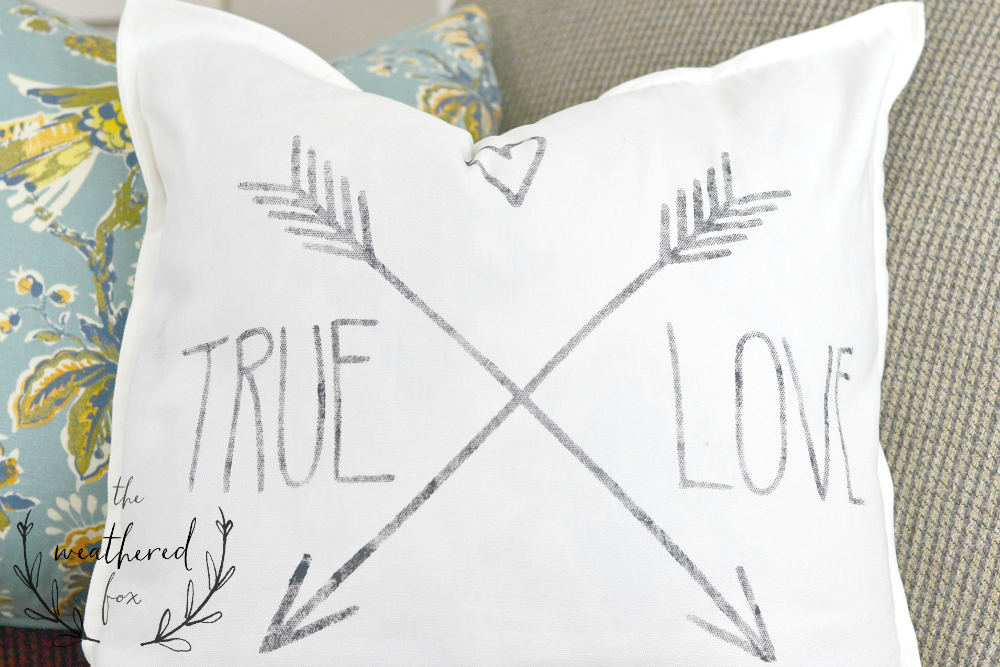 Stencil Pillow DIY Tutorial. This is such a quick 20 minute project that makes a huge home decor statement! I'm getting a Cricut after seeing this! Great Valentines Day Gift!