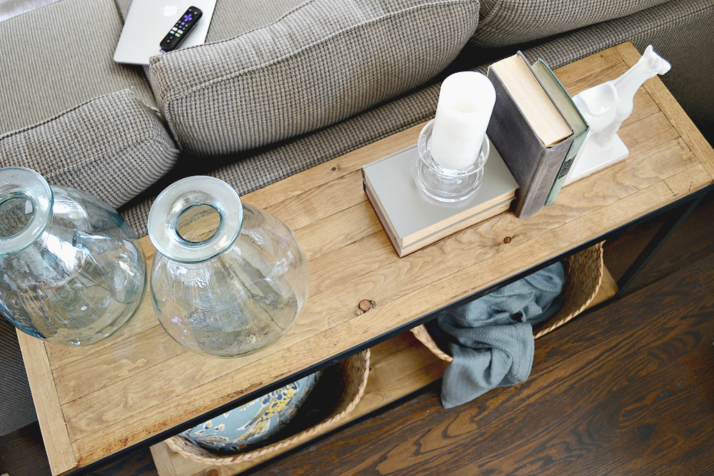 DIY Industrial Farmhouse sofa table. Turn a metal shelf into rustic shelving. Check out more at theweatheredfox.com