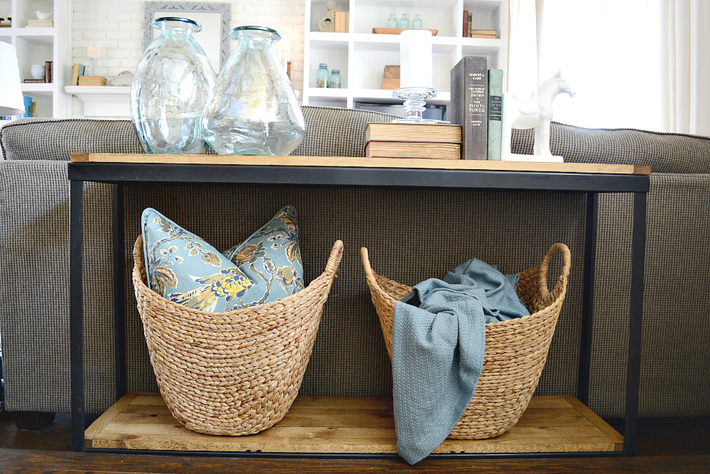 Industrial farmhouse sofa table DIY. Turn a metal shelf into rustic shelving. Find out more at theweatheredfox.com