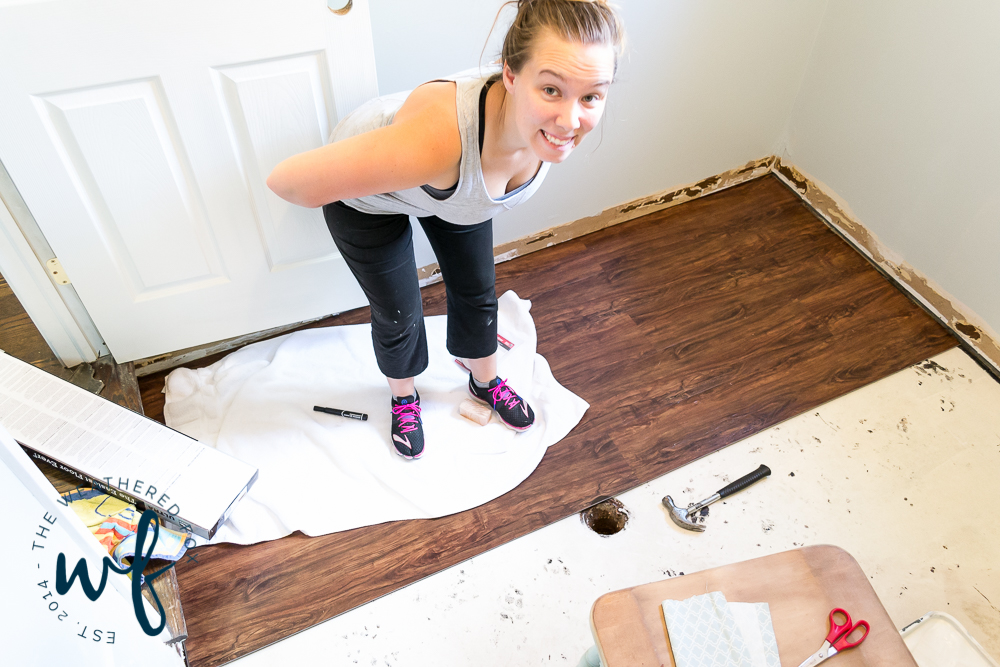 installing-vinyl-plank-flooring-in-laundry-room-3