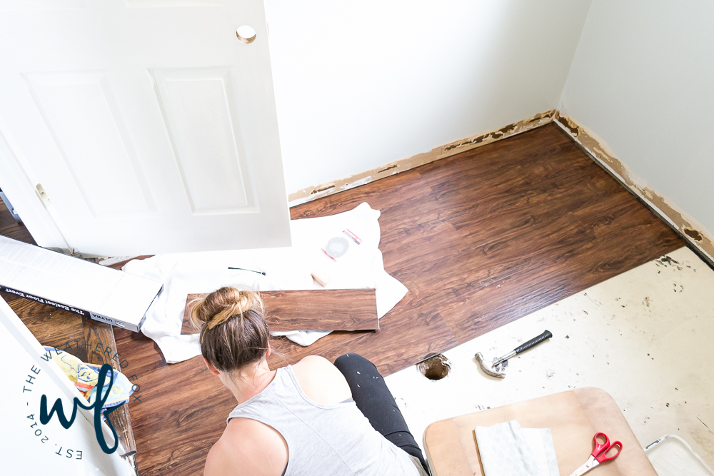 installing-vinyl-plank-flooring-in-laundry-room-4