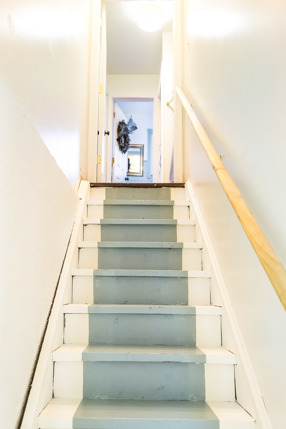 How to paint basement stairs and give wood stairs a fresh farmhouse style. Paint your stairs in a few easy steps! 