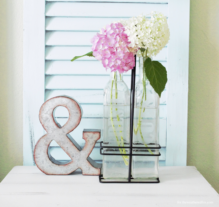 Creating a DIY farmhouse vase is easy using some upcylced bottles and etching cream. I love the clean, farmhouse style and these will blend perfectly! - www.theweatheredfox.net