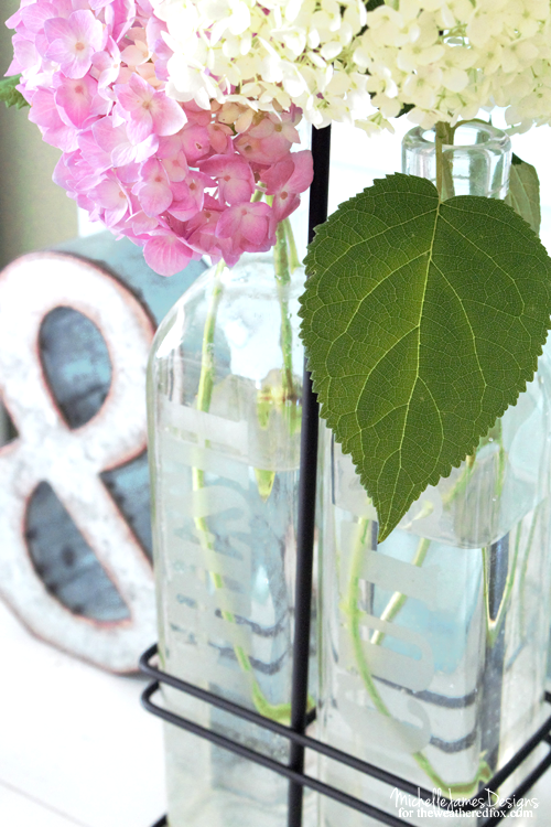 Creating a DIY farmhouse vase is easy using some upcylced bottles and etching cream. I love the clean, farmhouse style and these will blend perfectly! - www.theweatheredfox.net
