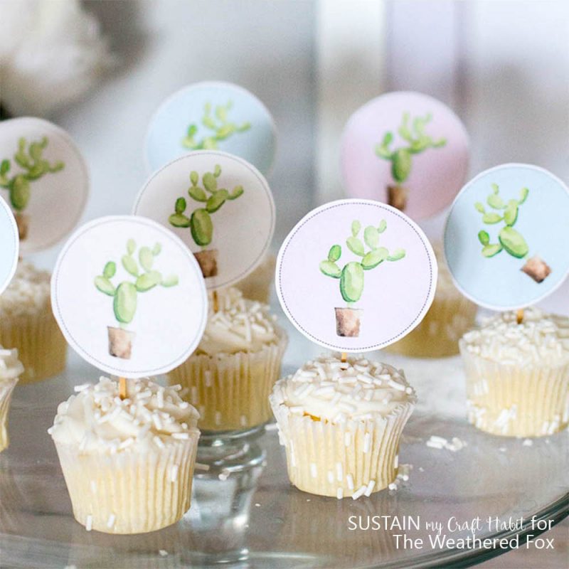 So adorable! Free printable watercolor cactus cupcake toppers and garland. Perfect for a baby shower, cinco de mayo party idea, fiesta party or birthday.