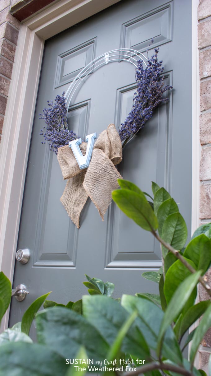 Learn how to make this simple and beautiful lavender wreath with a burlap bow and monogram letter! Full step-by-step tutorial is included.