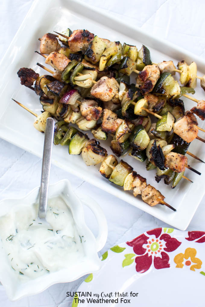 Simply seasoned grilled chicken shish kabob recipe with a creamy dill dip. Delicious low-fat, gluten free dinner or BBQ idea!