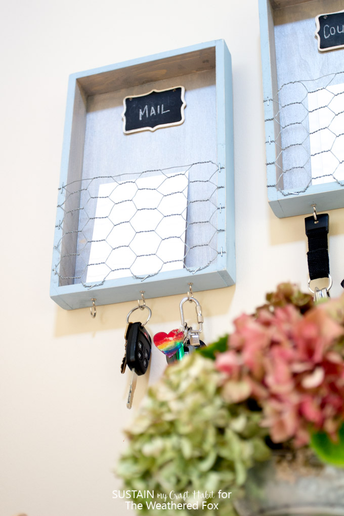 Get your home organized with a DIY entryway organizer. This farmhouse style home organization idea is a great place for your keys, coupons and to sort incoming mail! Full tutorial included.