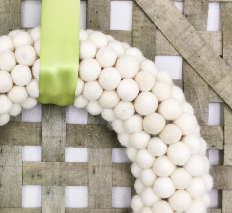 If you’re loving pom pom crafts, then you are going to love this white felt ball wreath tutorial! I show you how to make an easy felt pom pom wreath that will look amazing as part of your home decor for any season!